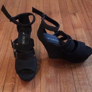 Black strapy platform wedges.
